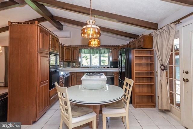 kitchen featuring a kitchen island, black appliances, lofted ceiling with beams, and light tile patterned floors