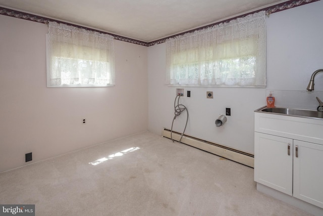 clothes washing area with hookup for an electric dryer, sink, light colored carpet, a baseboard radiator, and washer hookup