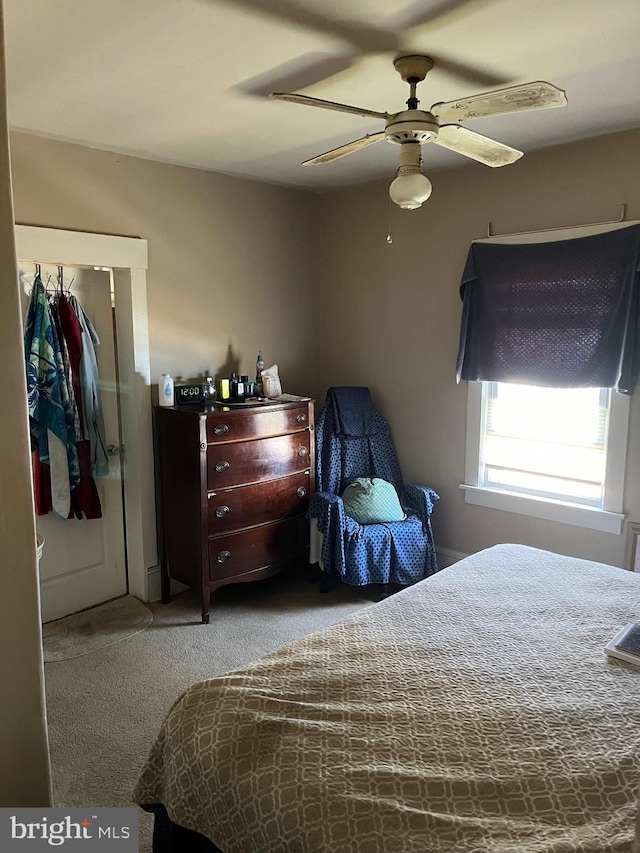 carpeted bedroom featuring ceiling fan