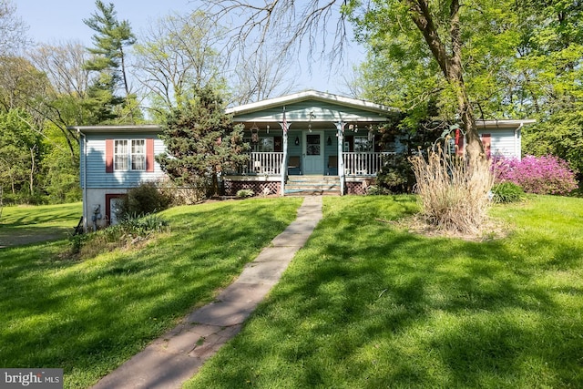 view of front of property with a porch and a front yard