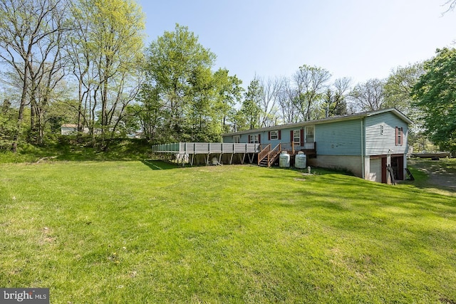 view of yard featuring a deck