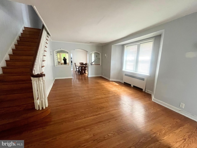 interior space featuring hardwood / wood-style flooring and radiator