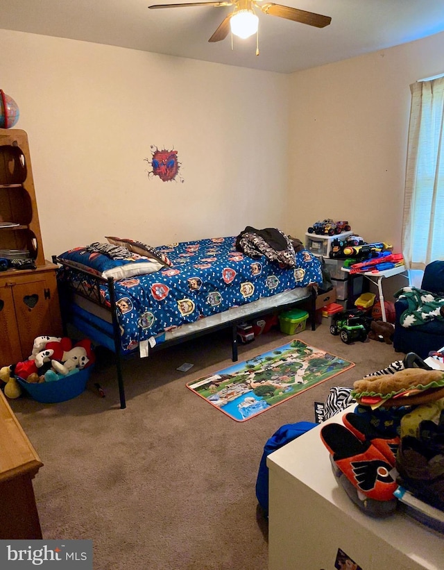 bedroom with ceiling fan and carpet flooring