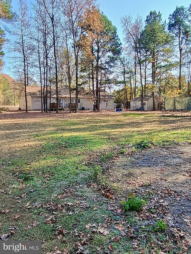 view of yard featuring a trampoline