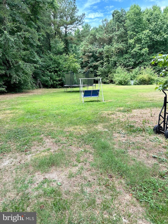 view of yard featuring a trampoline