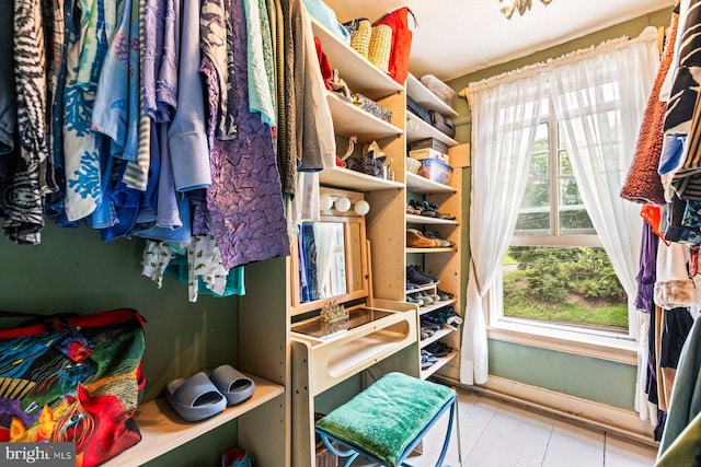 spacious closet featuring light tile patterned floors