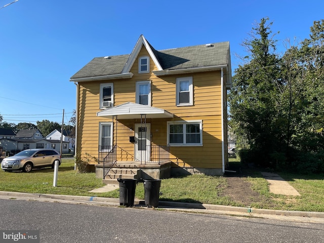 view of front of house with a front lawn