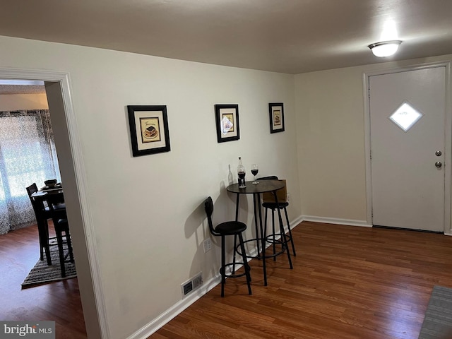 entrance foyer with dark hardwood / wood-style floors