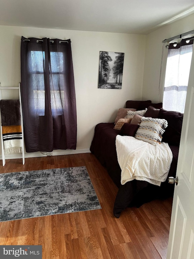 bedroom with hardwood / wood-style floors