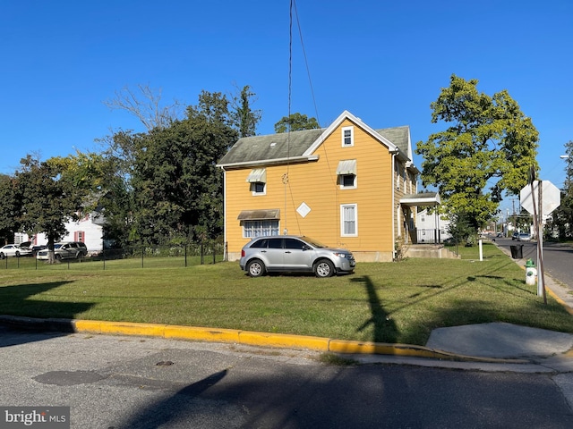 view of property exterior with a yard