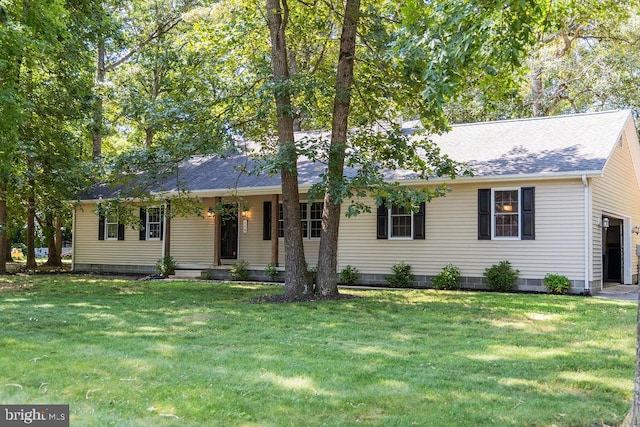 single story home featuring a front yard, a porch, and a garage