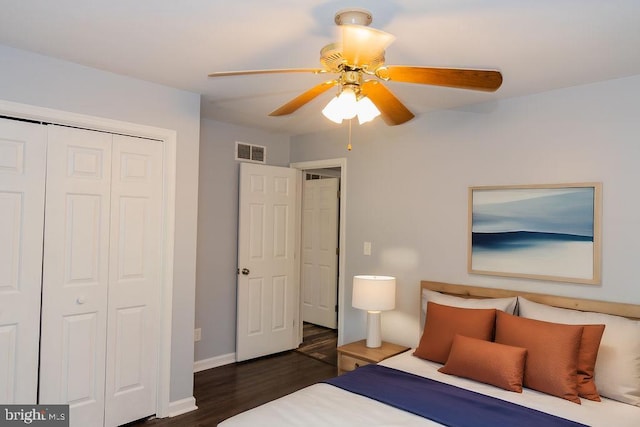 bedroom with ceiling fan, dark hardwood / wood-style flooring, and a closet