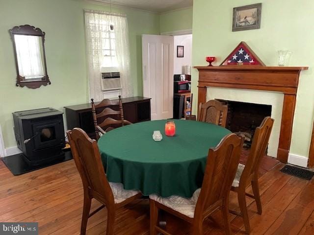 dining room featuring cooling unit and wood-type flooring