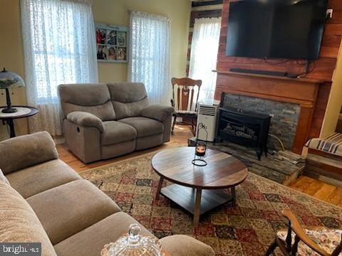 living room featuring hardwood / wood-style flooring and a fireplace