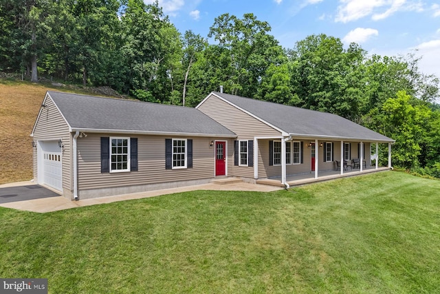 ranch-style house featuring a front lawn, covered porch, and a garage