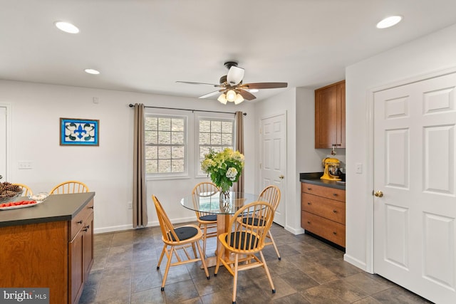 dining space with ceiling fan