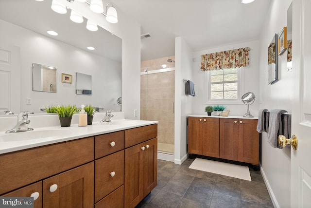 bathroom featuring vanity and a shower with shower door