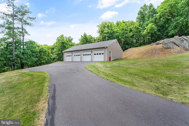 garage featuring a yard