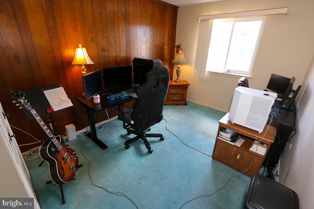 carpeted office space with wood walls