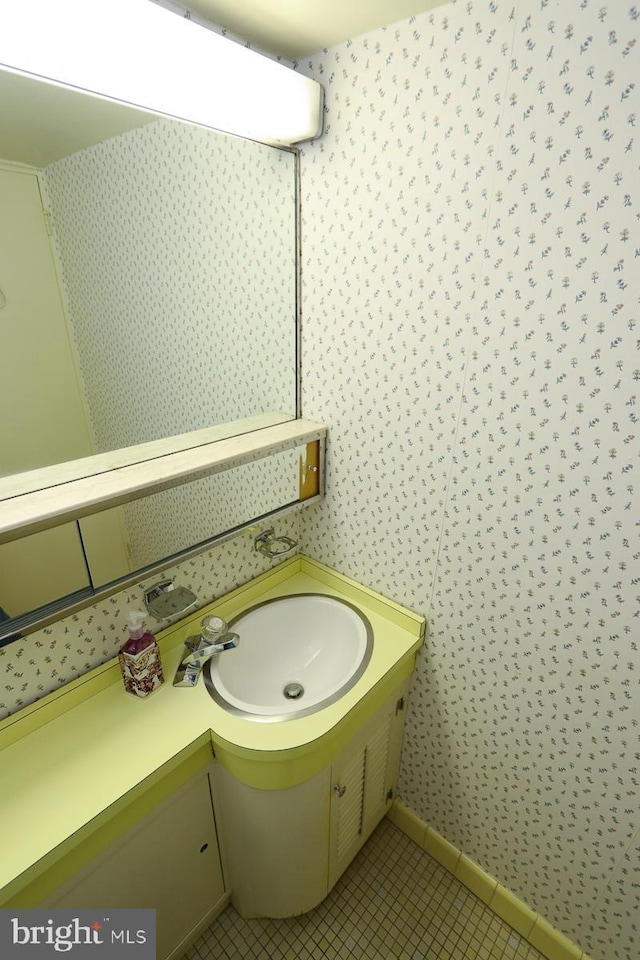 bathroom with tile patterned flooring and vanity