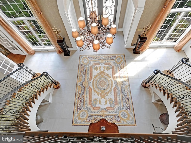 interior space featuring a chandelier and a high ceiling