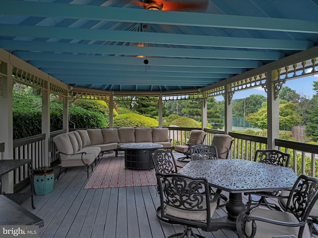 wooden deck featuring an outdoor living space