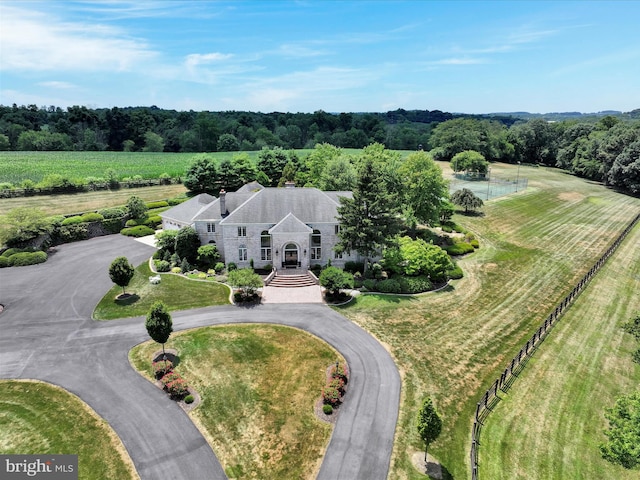 birds eye view of property with a rural view