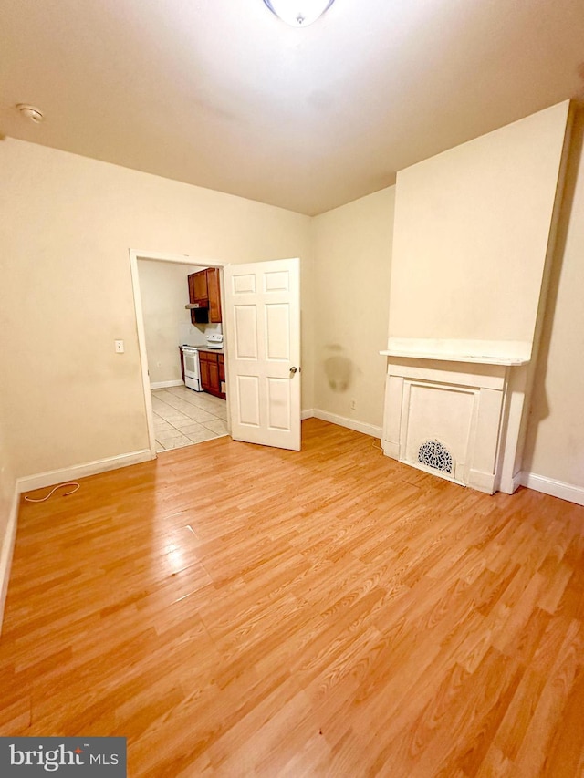 unfurnished living room featuring light hardwood / wood-style floors