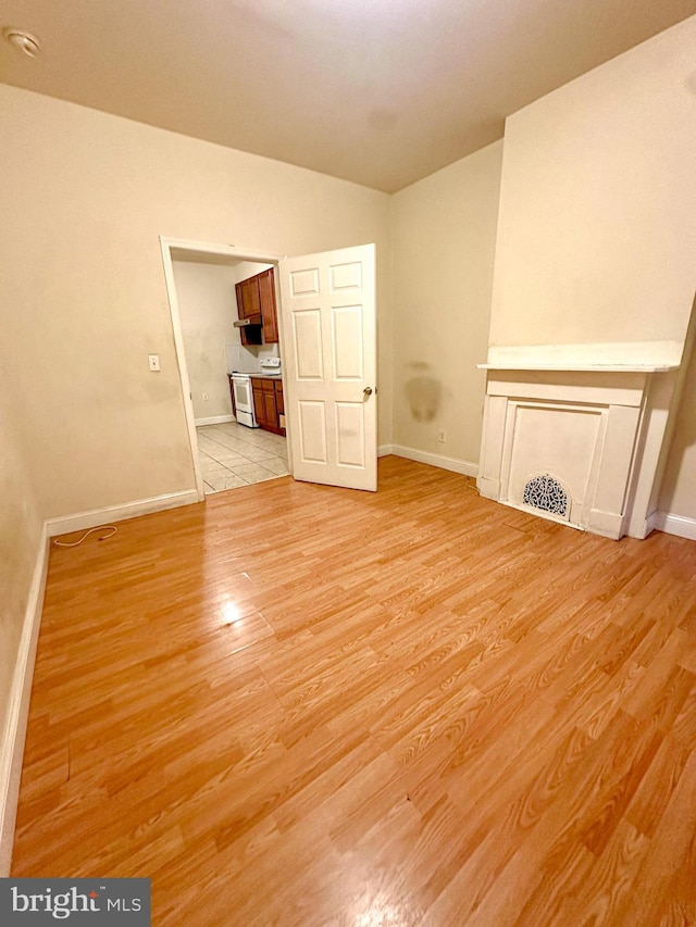 unfurnished living room with light wood-type flooring