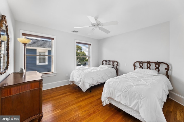 bedroom featuring dark wood-type flooring and ceiling fan