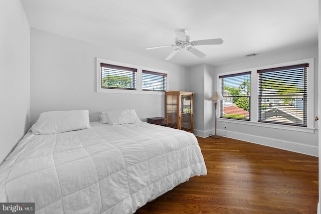 bedroom with hardwood / wood-style flooring and ceiling fan