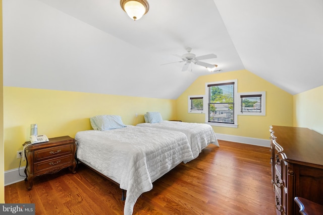 bedroom featuring lofted ceiling, dark hardwood / wood-style floors, and ceiling fan