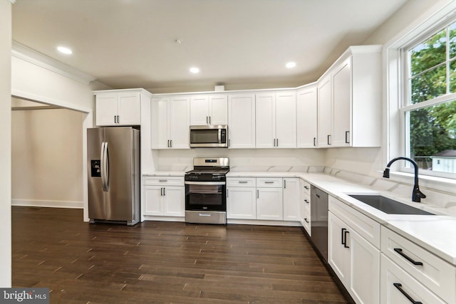 kitchen featuring sink, white cabinets, and stainless steel appliances