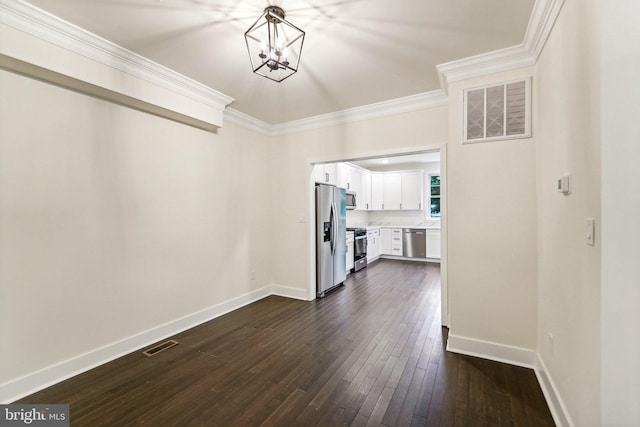 interior space featuring a notable chandelier, dark hardwood / wood-style flooring, and ornamental molding