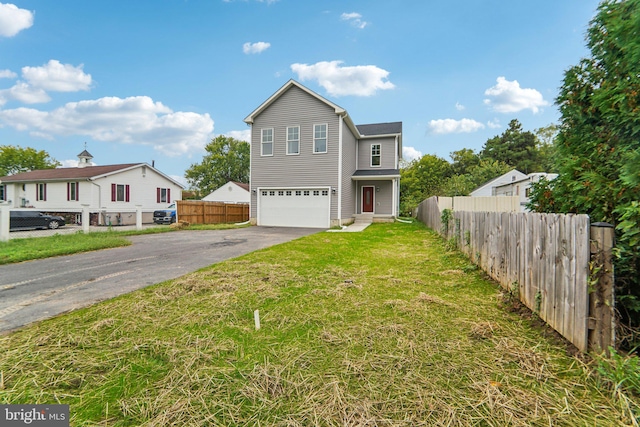 front of property featuring a garage and a front yard