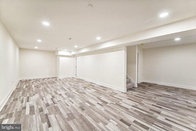 basement featuring light hardwood / wood-style flooring