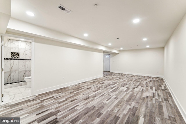 basement featuring light hardwood / wood-style flooring