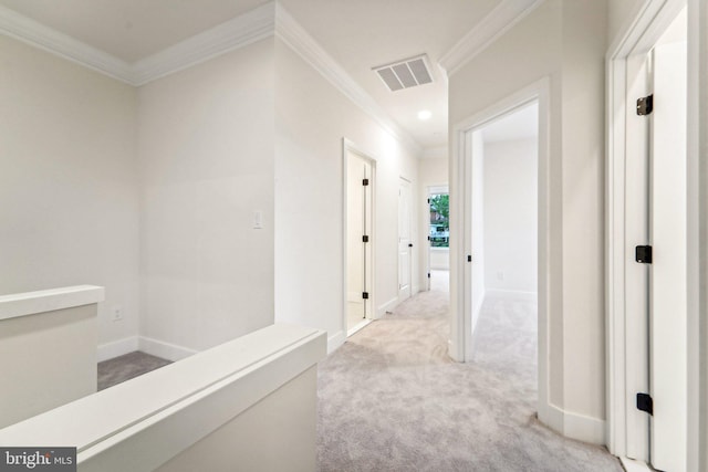 corridor with light colored carpet and crown molding