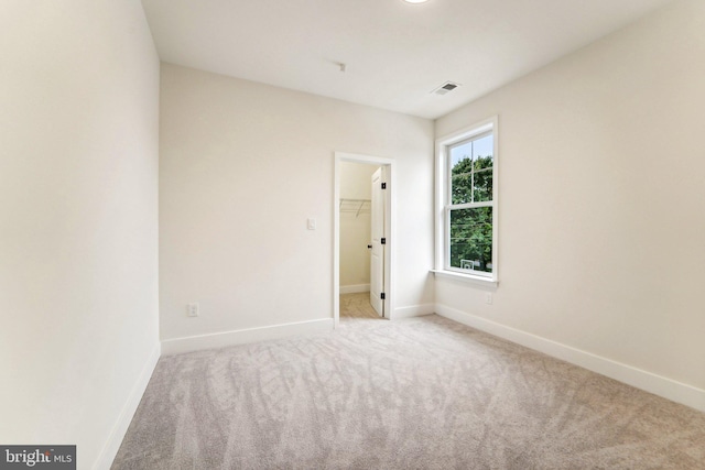 empty room featuring light carpet