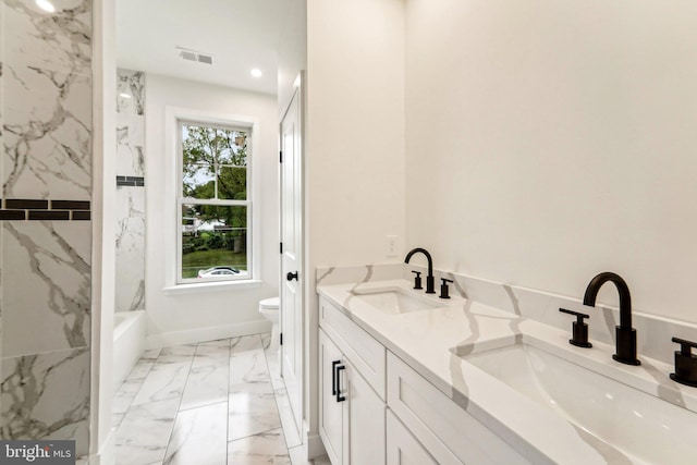 bathroom with toilet and vanity