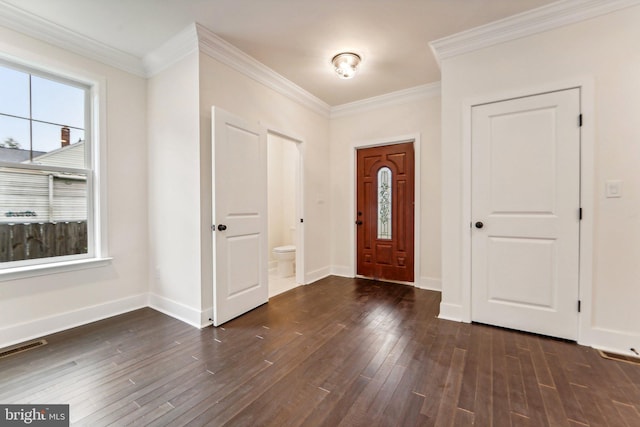 foyer entrance featuring dark hardwood / wood-style flooring and crown molding