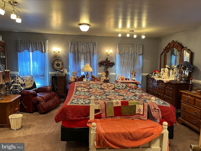 bedroom featuring carpet floors, crown molding, and multiple windows