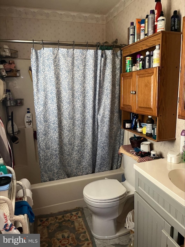 full bathroom with shower / bath combo, toilet, and vanity