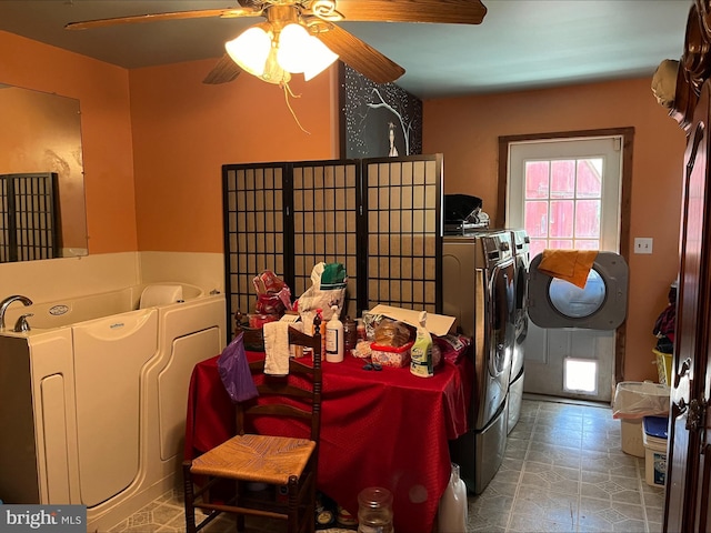 laundry room featuring separate washer and dryer and ceiling fan