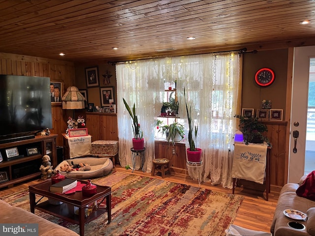 living room with hardwood / wood-style floors and wooden ceiling