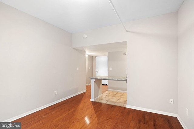 unfurnished room with light hardwood / wood-style floors