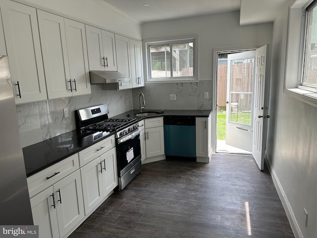 kitchen featuring sink, stainless steel appliances, backsplash, and white cabinets