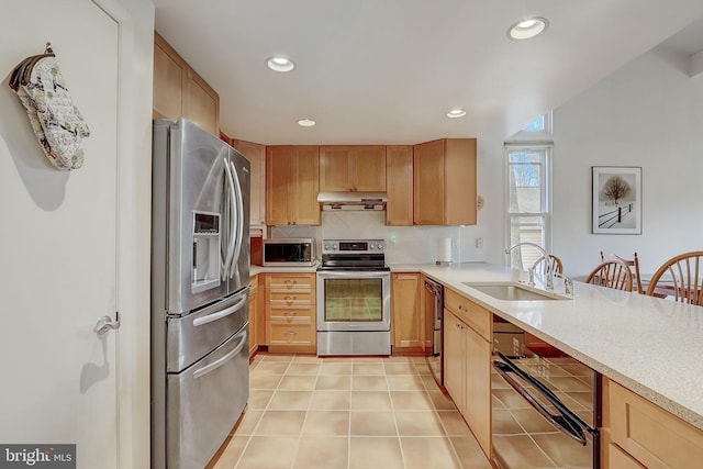 kitchen with decorative backsplash, light tile patterned flooring, sink, and appliances with stainless steel finishes