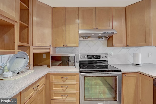 kitchen featuring tasteful backsplash, light stone countertops, exhaust hood, and stainless steel electric range