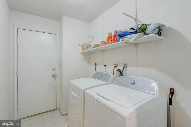 washroom featuring independent washer and dryer